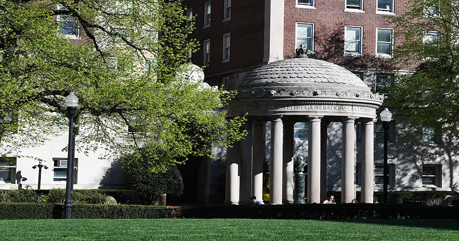 image of Van Am Quad positioned in center of green trees on the campus of Columbia University 